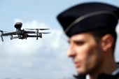 A drone, seen over the Promenade des Anglais, is used by French police to remind citizens of the coronavirus confinement measures in Nice, France [Eric Gaillard/Reuters]