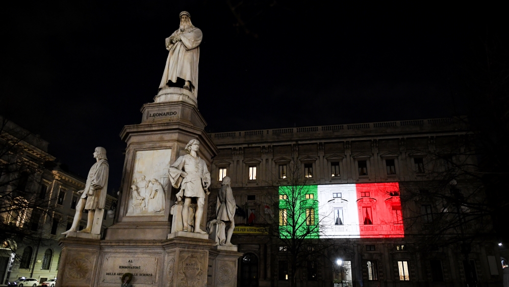 The Palazzo Marino building is seen iluminated with the colours of the Italian flag as the spread of coronavirus disease (COVID-19) continues, in Milan