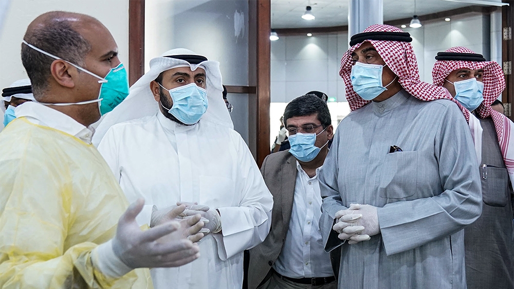 A photo provided by the Kuwaiti news agency KUNA on March 13, 2020 shows Kuwait's Prime Minister Sheikh Sabah al-Khaled al-Sabah (2nd-R), Health Minister Sheikh Basel al-Sabah (2nd-L), and Interior Mi