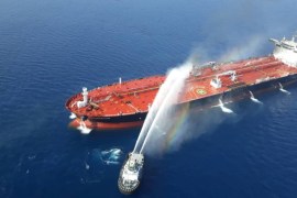 An Iranian navy boat tries to stop the fire of an oil tanker after it was attacked in the Gulf of Oman, June 13, 2019. Tasnim News Agency/Handout via REUTERS
