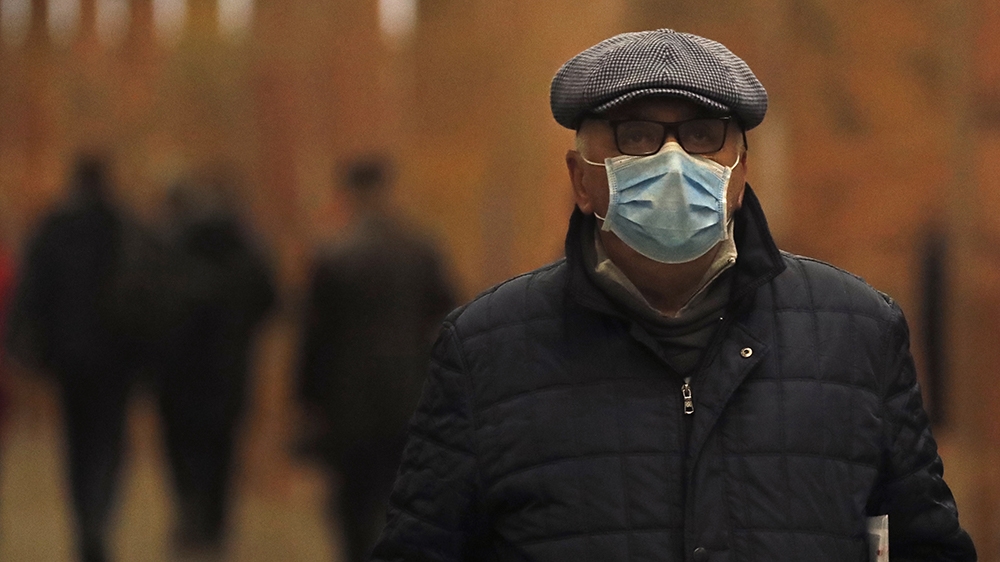 epa08267476 A passenger wearing a protective face mask travels on a Metro in Moscow, Russia, 03 March 2020. People with symptoms of acute viral respiratory infections who arrived to Moscow from countr