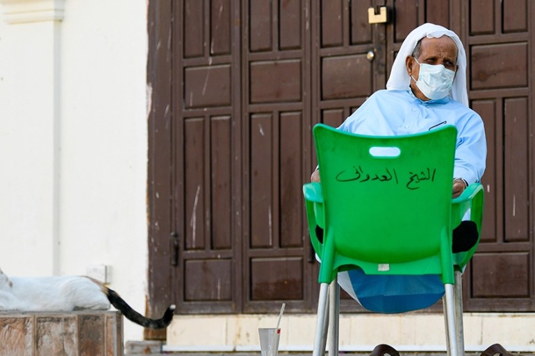 An elderly man wearing a protective mask sits in front of a closed shop Jeddah, Saudi Arabia, 24 March 2020. According to local media reports Saudi Arabia has registered 51 new cases on 23 March bring