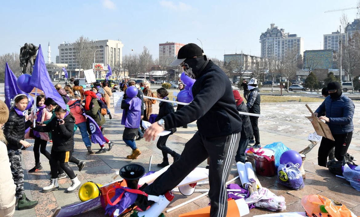 Masked Kyrgyz nationalists attack women''s rights activists during the celebration of the International Women''s Day at Victory Square in Bishkek, Kyrgyzstan, Sunday, March 8, 2020. (AP Photo/Vladimir V
