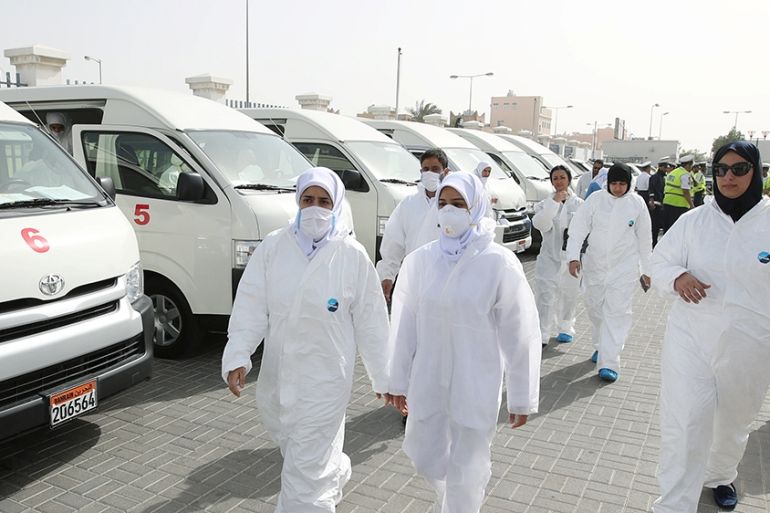 A team of doctors and nurses prepare themselves before heading out to their designated residential areas to check on residents who returned from Iran if anyone is infected with the novel coronavirus,