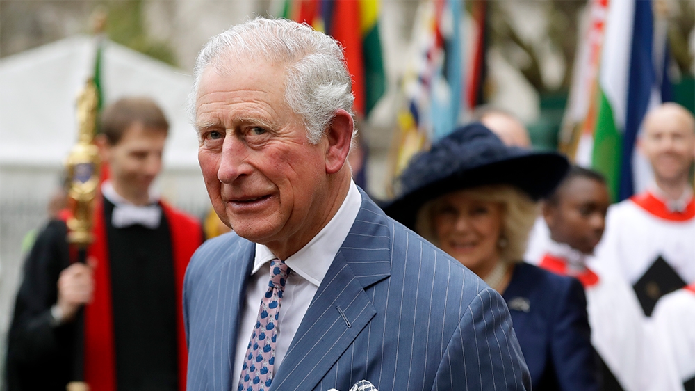 Britain's Prince Charles and Camilla the Duchess of Cornwall, in the background, leave after attending the annual Commonwealth Day service at Westminster Abbey in London, Monday, March 9, 2020. The an