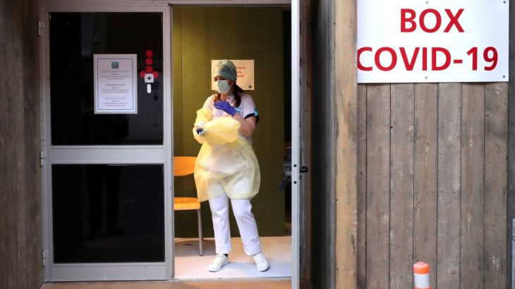 A nurse waits at the entrance of a testing site for coronavirus disease (COVID-19) at the Saint Michel Hospital in Brussels