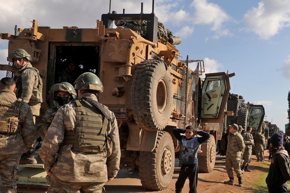 A Turkish military convoy is seen parked near the town of Batabu on the highway linking Idlib to the Syrian Bab al-Hawa border crossing with Turkey, on March 2, 2020. - The Syrian government pledged t