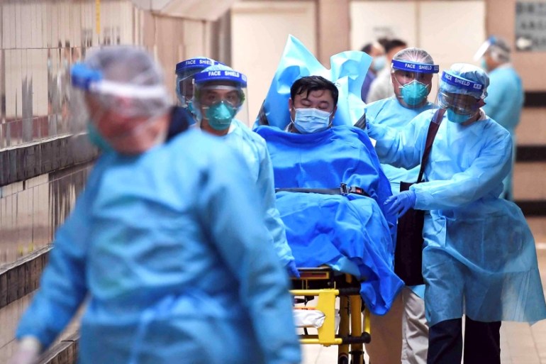 Medical staff transfer a patient of a highly suspected case of a new coronavirus at the Queen Elizabeth Hospital in Hong Kong, China January 22, 2020. Picture taken January 22, 2020. cnsphoto via REUT