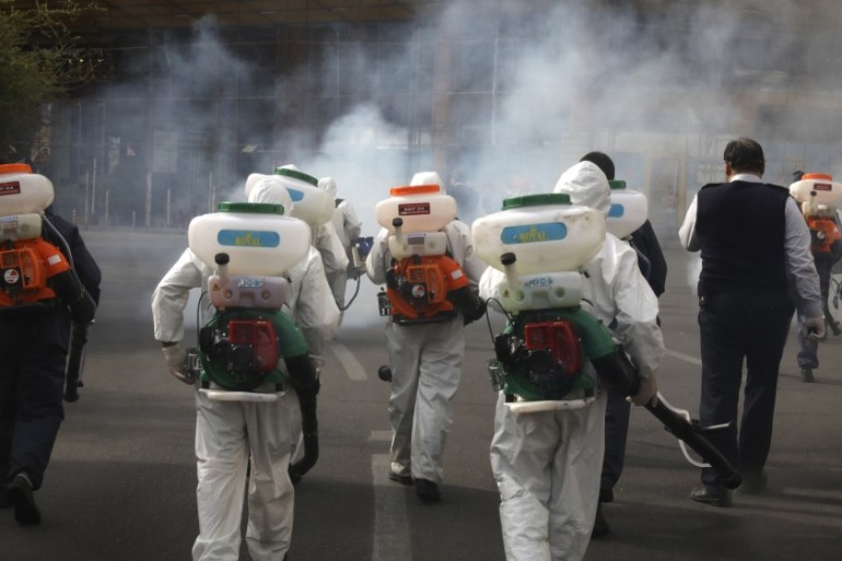 irefighters disinfect a square against the new coronavirus, in western Tehran, Iran, Friday, March 13, 2020. The new coronavirus outbreak has reached Iran''s top officials, with its senior vice preside