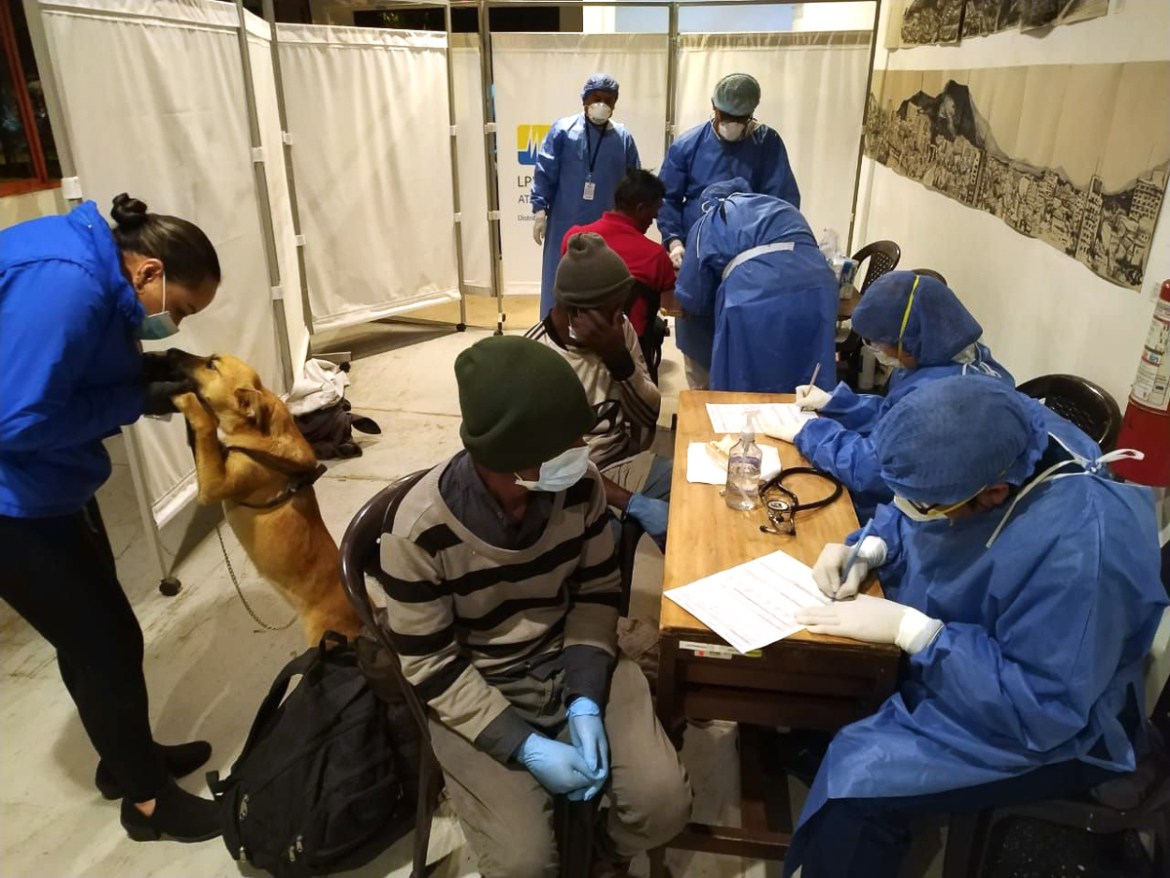 In this handout picture released by Quito''s Municipality workers attend homeless people at a temporary shelter in the House of Culture of Quito on March 20, 2020, during the coronavirus COVID-19 pande