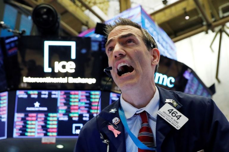 A trader works on the floor at the New York Stock Exchange (NYSE) in New York City, U.S., March 5, 2020. REUTERS/Andrew Kelly