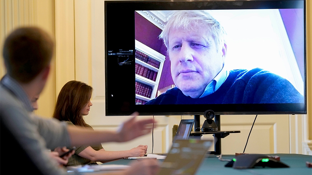In this handout photo provided by Number 10 Downing Street, Britain's Prime Minister Boris Johnson chairs the morning Covid-19 Meeting remotely after self isolating after testing positive for the coro