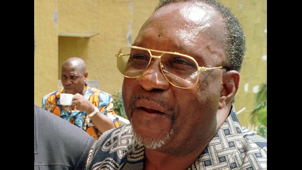 Former Congo Republic leader, Jacques-Joachim Yhomby-Opango, speaks to reporters while in exile in Ivory Coast October 28. Yhomby Opango, a former prime-minister, put his name to a call by the ousted 