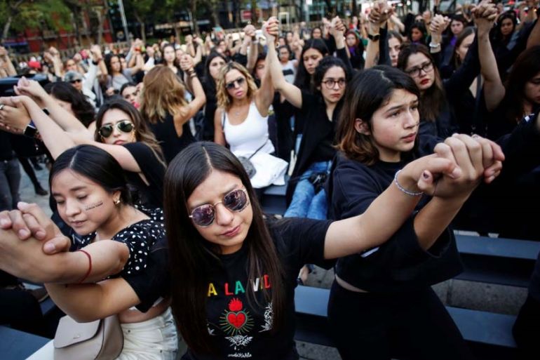 Women protest against gender violence and femicides at Angel de la Independencia monument in Mexico City, Mexico
