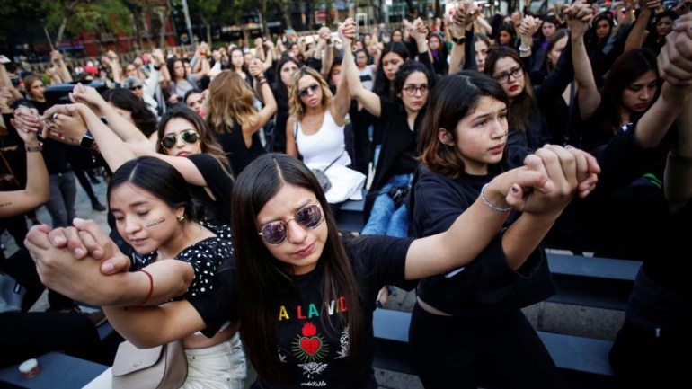 Women protest against gender violence and femicide at the Angel de la Independencia monument in Mexico City, Mexico