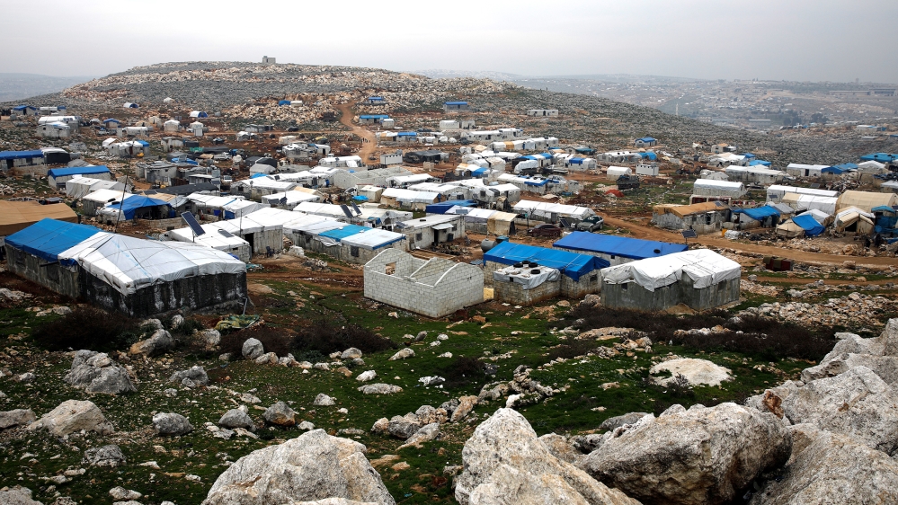 Makeshift shelters of internally displaced Syrians are seen from a hill top as part of an IDP camp located in Sarmada, Idlib province, Syria February 28, 2020. REUTERS/Umit Bektas