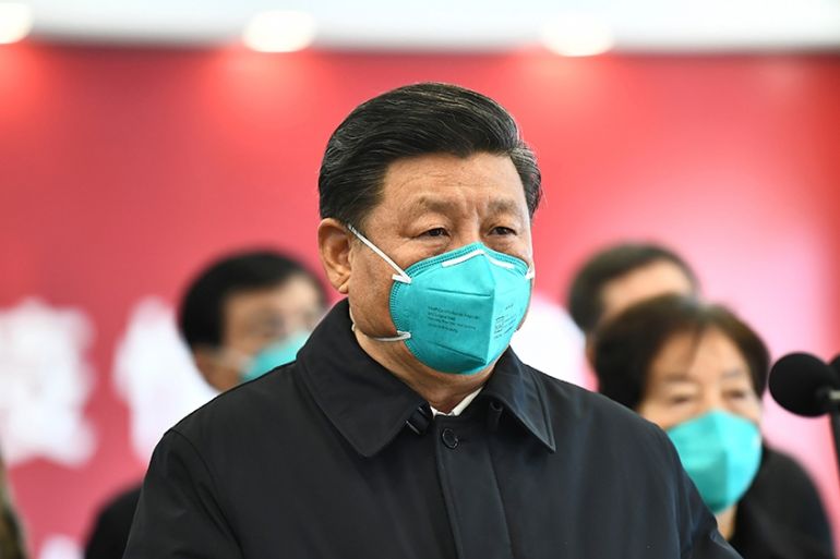 In this photo released by China’s Xinhua News Agency, Chinese President Xi Jinping talks by video with patients and medical workers at the Huoshenshan Hospital in Wuhan in central China’s Hubei Provin