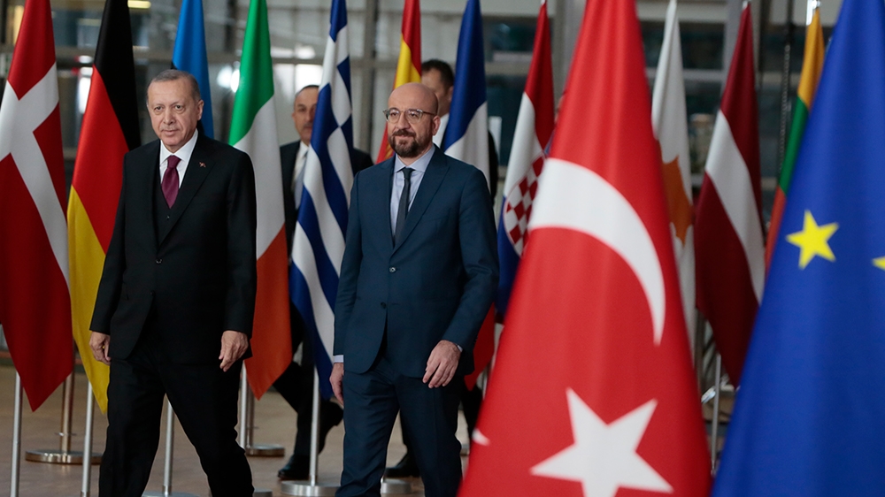 Turkish President Recep Tayyip Erdogan, left, walks with European Council President Charles Michel prior to a meeting at the European Council building in Brussels, Monday, March 9, 2020. Turkish Presi