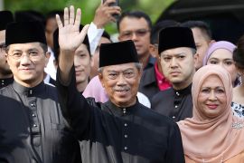 Malaysia''s Prime Minister Designate and former interior minister Muhyiddin Yassin waves to reporters before his inauguration as the 8th prime minister, outside his residence in Kuala Lumpur, Malaysia,