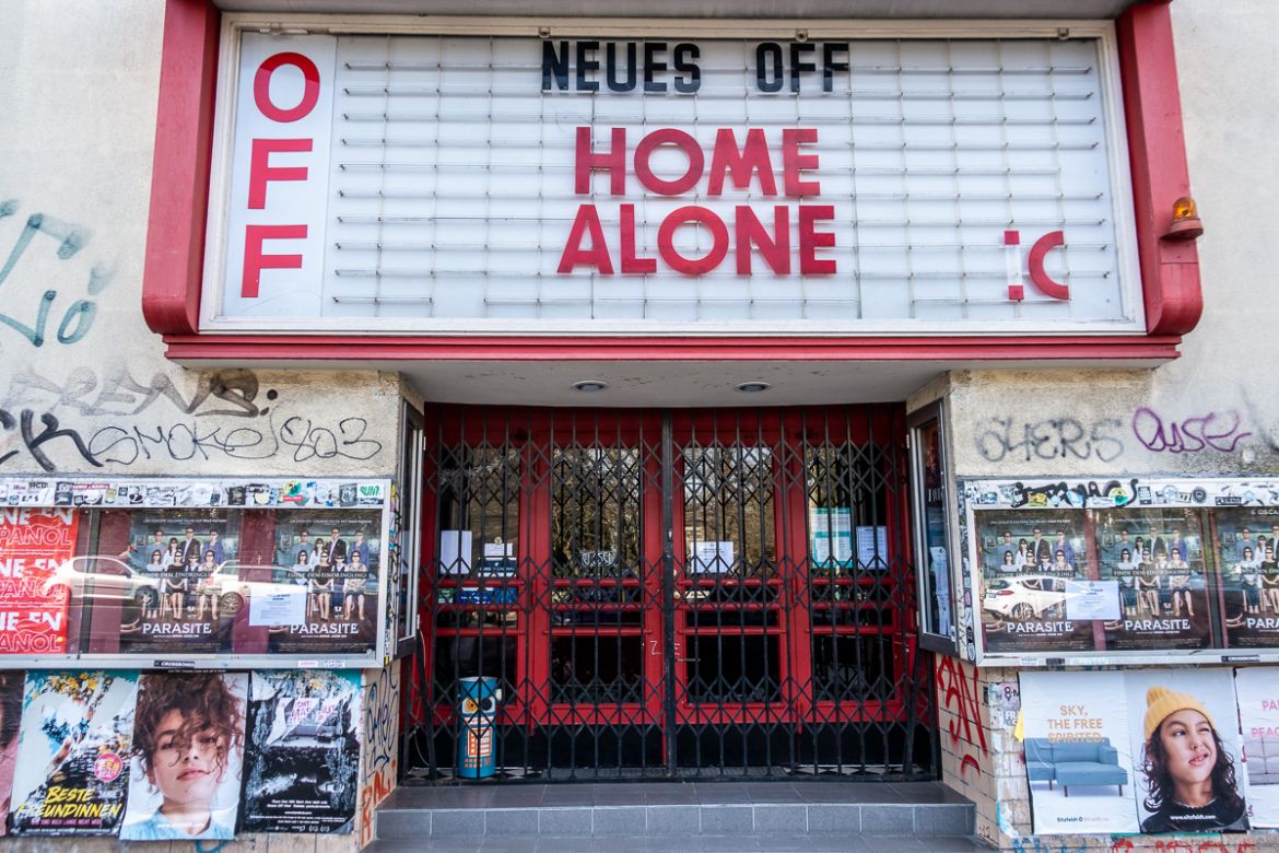 epa08304659 The Neues Off movie theater with its Marquee (letter board) banner reading ''Home Alone'' and a sad smiley face in Berlin, Germany, 18 March 2020. Many closed entertainment venues in the Ger