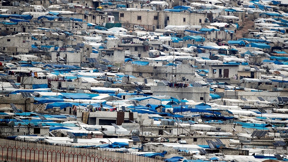 Tents housing internally displaced people in Atma camp in Idlib Governorate of Syria are seen on the Syrian side of the border zone near the Turkish village of Bukulmez in Hatay province, Turkey, Febr