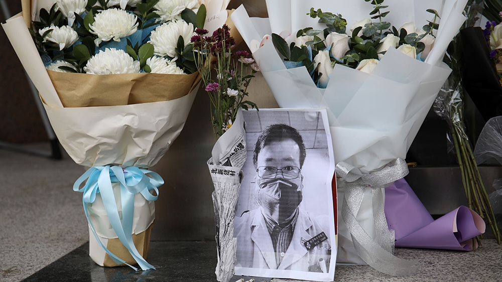 A makeshift memorial for Li Wenliang, a doctor who issued an early warning about the coronavirus outbreak before it was officially recognized, is seen after Li died of the virus, at an entrance to the