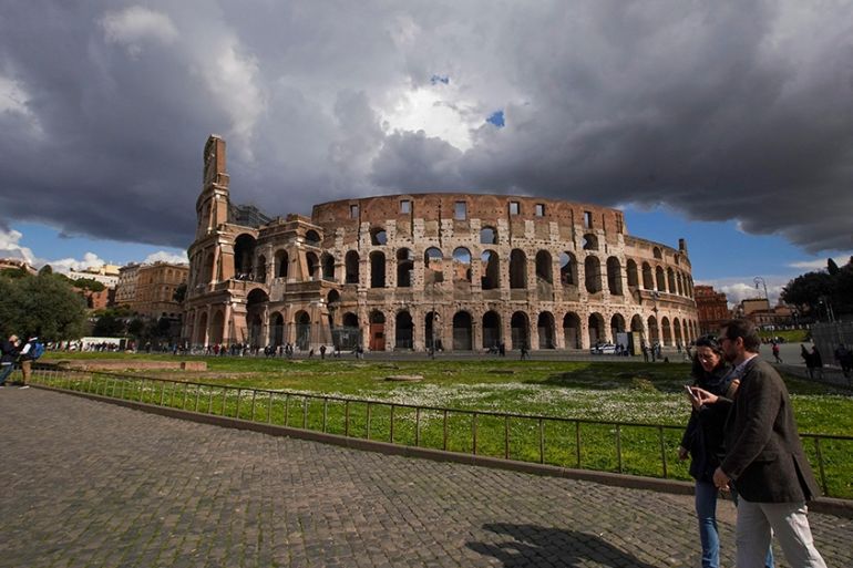 A view of the Colosseum, in Rome, Saturday, March 7, 2020. With the coronavirus emergency deepening in Europe, Italy, a focal point in the contagion, risks falling back into recession as foreign touri