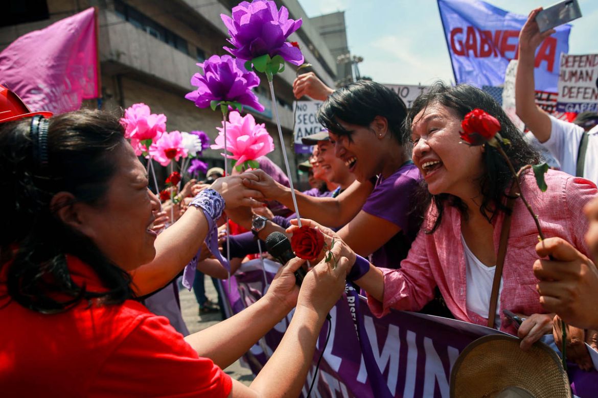 Filipino women exchange flowers during a protest on International Women''s Day in Manila, Philippines, March 8, 2020. REUTERS/Eloisa Lopez