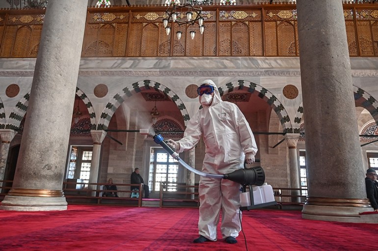 A member of Istanbul''s Municipality disinfects the Mihrimah Sultan Mosque in Istanbul to prevent the spread of the COVID-19, the novel coronavirus, on March 13, 2020. - Turkey said on March 12, 2020 i