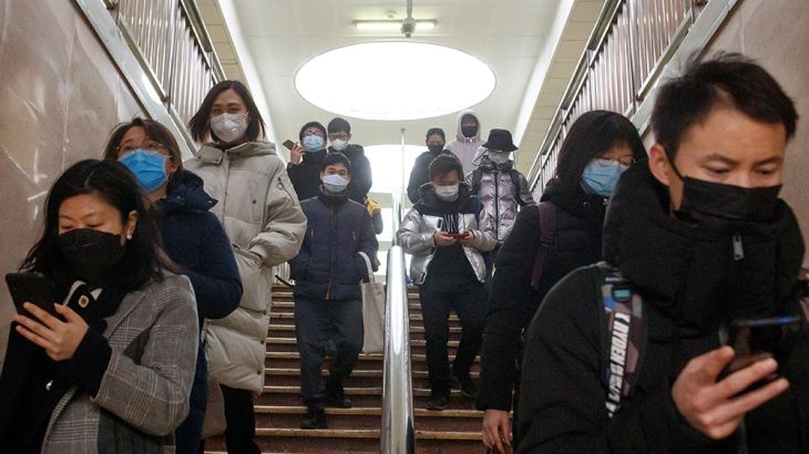 People wear face masks as they change subway lines in Beijing as the country is hit by an outbreak of the novel coronavirus, China, March 10, 2020. REUTERS/Thomas Peter