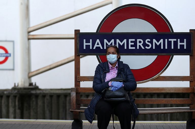 A commuter wearing a protective face mask at Hammersmith underground station as the spread of the coronavirus disease (COVID-19) continues, London, Britain, March 24, 2020. REUTERS/Hannah McKay