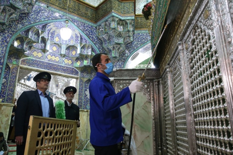 FILES) In this file photo taken on February 25, 2020, an Iranian sanitary workers disinfect Qom''s Masumeh shrine to prevent the spread of the coronavirus which reached Iran, where there were concerns