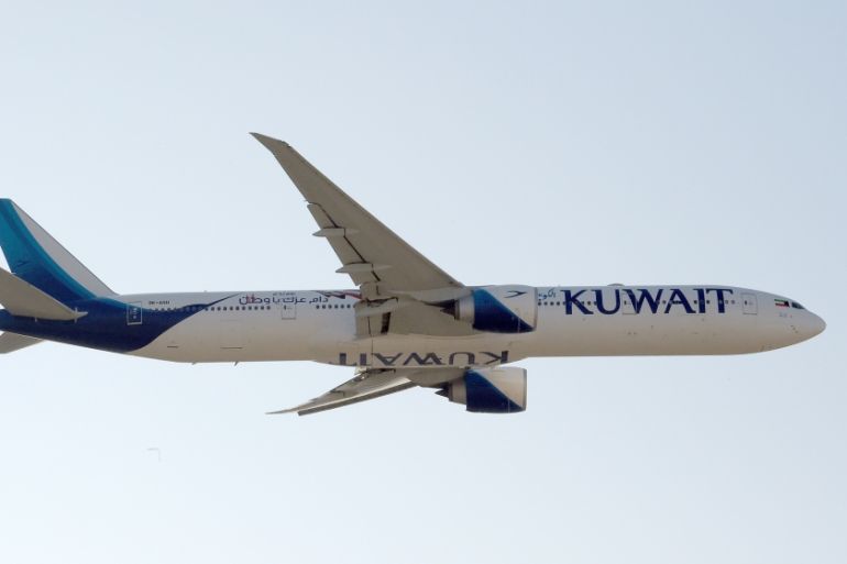 A Kuwait Airways Boeing B777 aircraft performs air maneuvers during the 2018 Bahrain International Airshow (BIAS) at the Sakhir Airbase, south of the Bahraini capital Manama on November 14 2018. STR