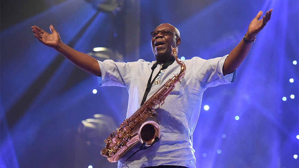 (FILES) In this file photo taken on June 29, 2018 Cameroon jazz saxophonist Manu Dibango performs during a concert at the Ivory Hotel in Abidjan. - Veteran Cameroon jazz star Dibango dies after contra