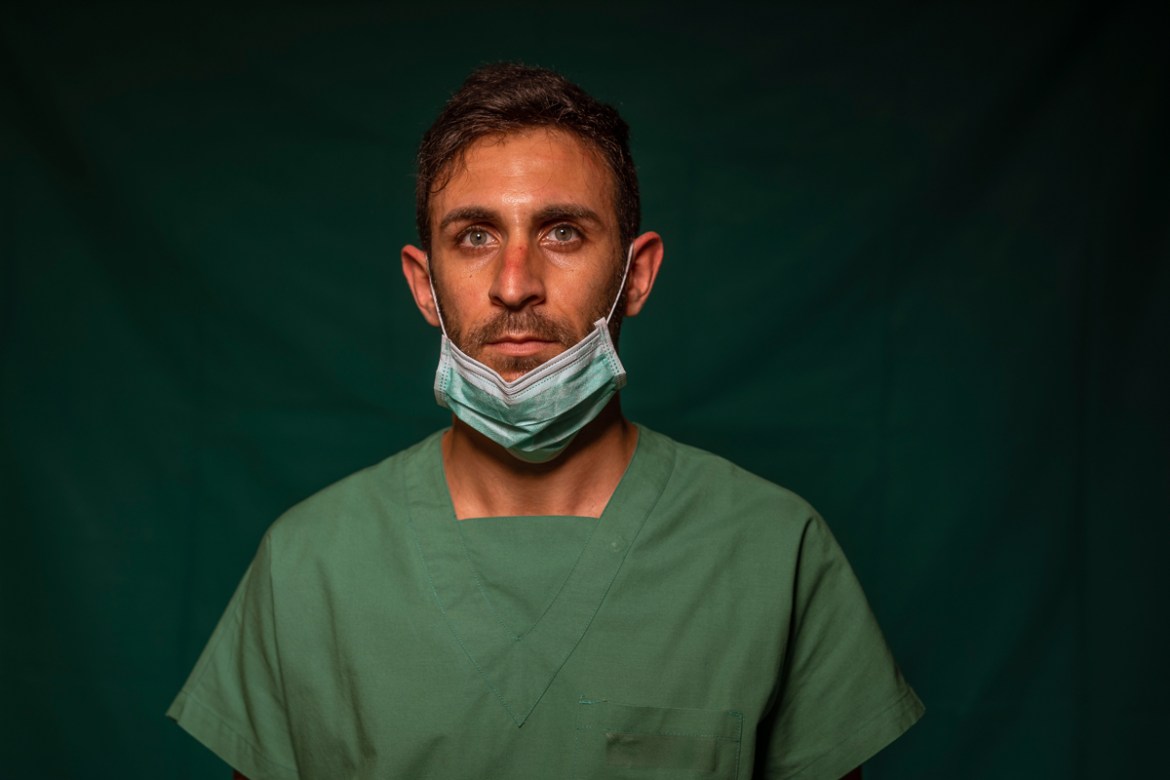 Daniele Rondinella, 30, an ICU nurse at Rome''s COVID 3 Spoke Casalpalocco Clinic poses for a portrait, Friday, March 27, 2020, during a break in his daily shift. The intensive care doctors and nurses