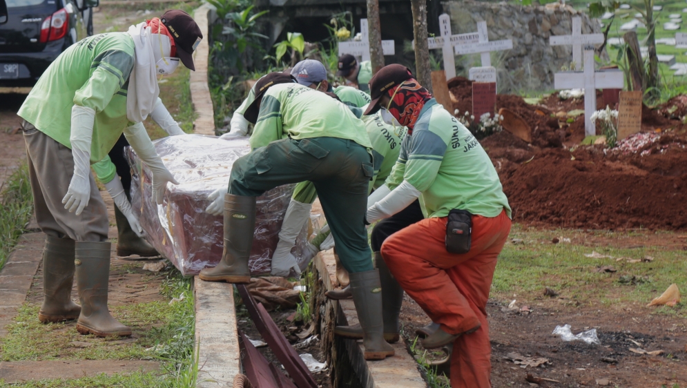 Burial for coronavirus victims in Indonesia