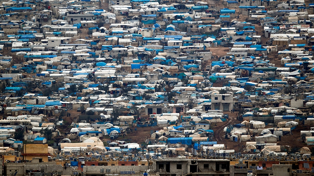 Tents housing internally displaced people in Atma camp in Idlib Governorate of Syria are seen on the Syrian side of the border zone near the Turkish village of Bukulmez in Hatay province, Turkey, Febr
