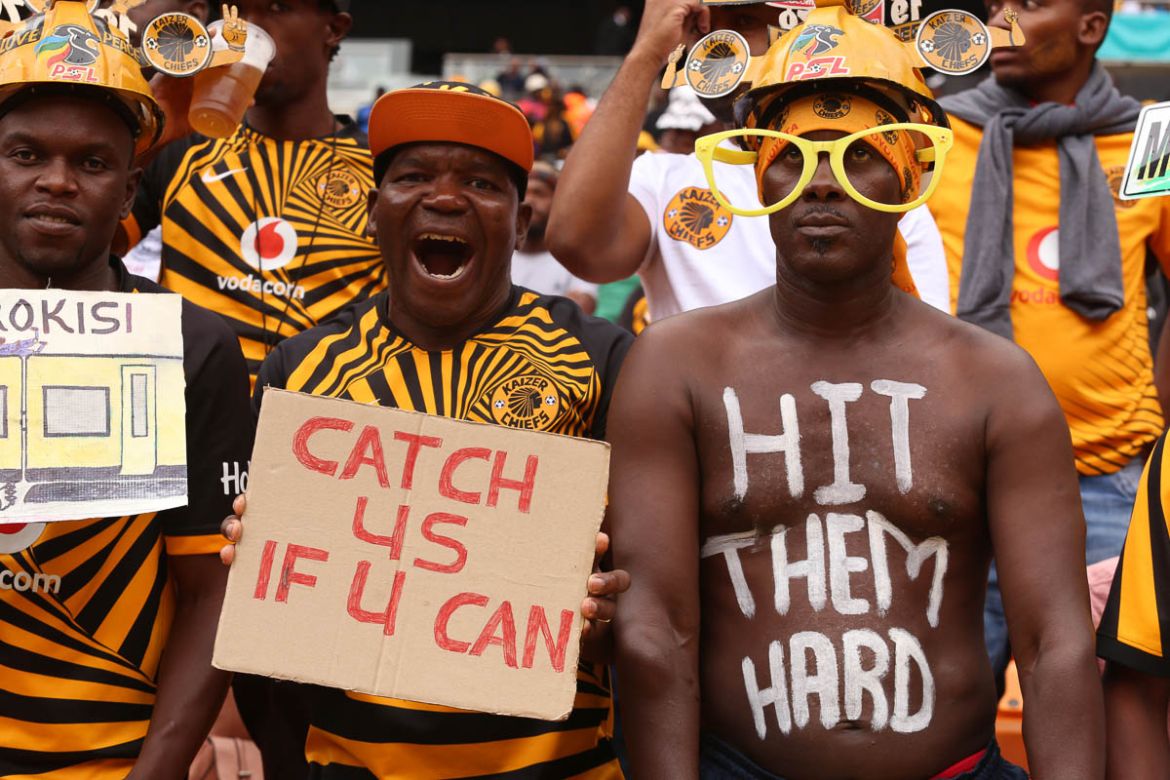 Kaizer chiefs fans Bolelang Gape who normally has a body sign reading ‘ hit them hard’ referring to the defeat he foresees Orlando Pirates suffering in the hands of Kaizer chiefs at FNB stadium South