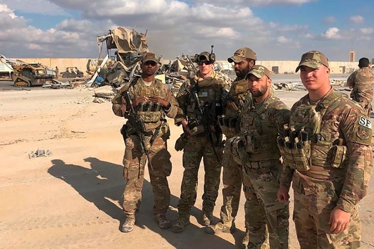 U.S. Soldiers stand in the site of the Iranian bombing at Ain al-Asad air base in Anbar, Iraq, Monday, Jan. 13, 2020. Ain al-Asad air base was struck by a barrage of Iranian missiles on Wednesday, in