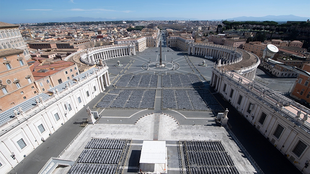 A photo taken and handout by the Vatican Media on March 12, 2020 shows a deserted St. Peter's Square two days after it was closed to tourists as part of a broader clampdown aimed at curbing the corona
