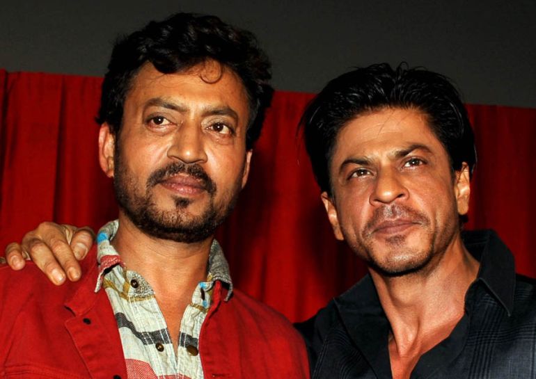 Indian Bollywood actors Irrfan Khan (L) and Shah Rukh Khan pose for a photograph during a promotional event for the forthcoming Hindi film ''Ekkees Toppon Ki Salaami'' directed by Ravindra Gautam in Mum