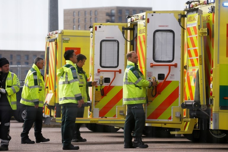 Paramedics and ambulances are seen outside the Excel Centre, London while it is being prepared to become the NHS Nightingale Hospital, as the spread of the coronavirus disease (COVID-19) continues, Lo