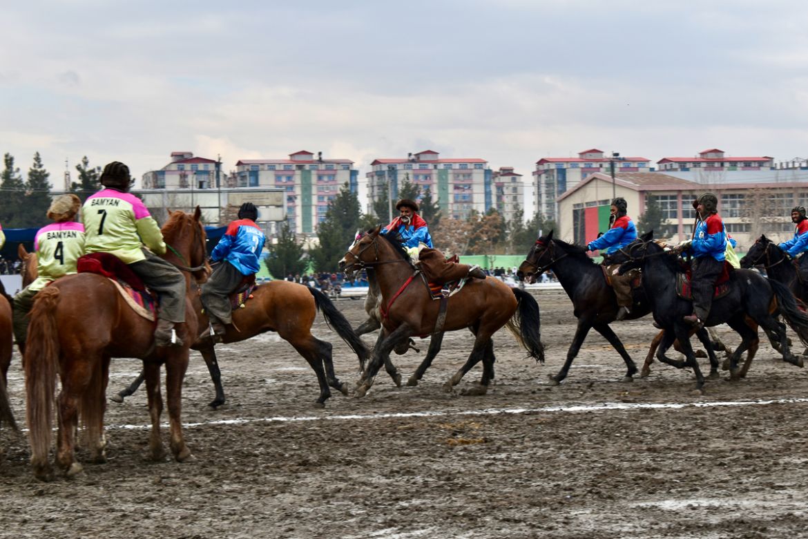 A game of Buzkashi between players from Baghlan and Bamyan province, on the second day of the Buzkashi league, at Chaman-e-Hazouri stadium in Kabul on Thursday. Photo by Hikmat Noori.