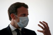 Emmanuel Macron talks with health workers at a medical centre in Pantin as the spread of the coronavirus disease continues in France, April 7, 2020 [Gonzalo Fuentes/Reuters]