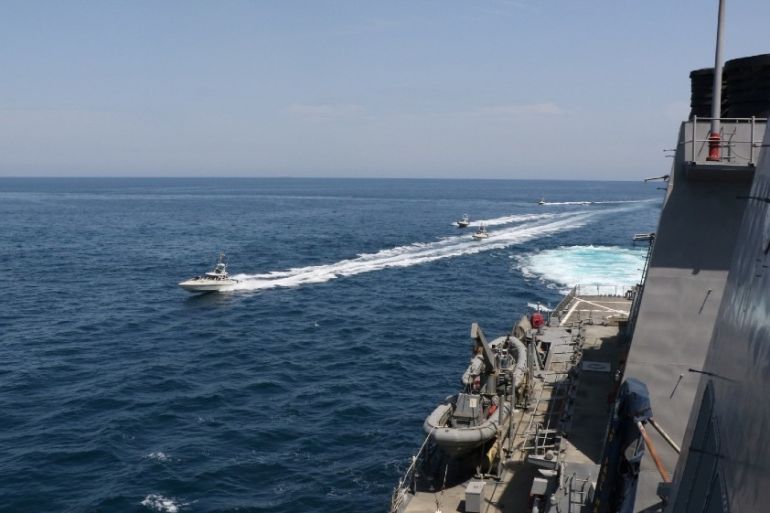 Four Iranian Islamic Revolutionary Guard Corps Navy (IRGCN) vessels, some of several to maneuver in what the U.S. Navy says are "unsafe and unprofessional actions against