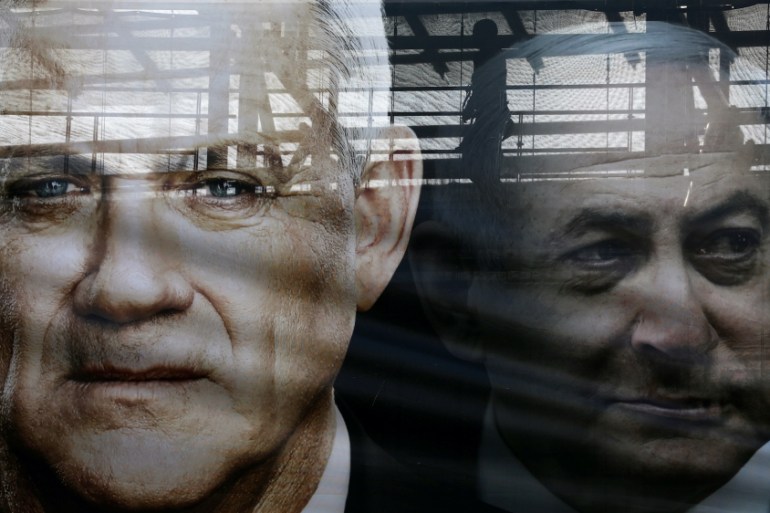 Netanyahu Gantz campaign banner Reuters