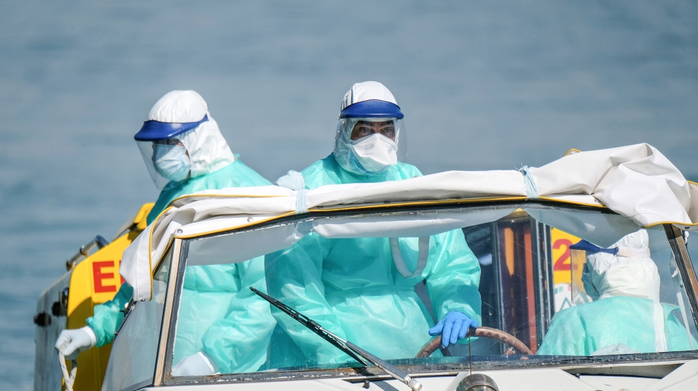 Health workers arrive by boat ambulance at a Venice hospital on Good Friday as Italy celebrates Easter under lockdown to try and stop the spread of the coronavirus disease (COVID-19) April 10, 2020. R