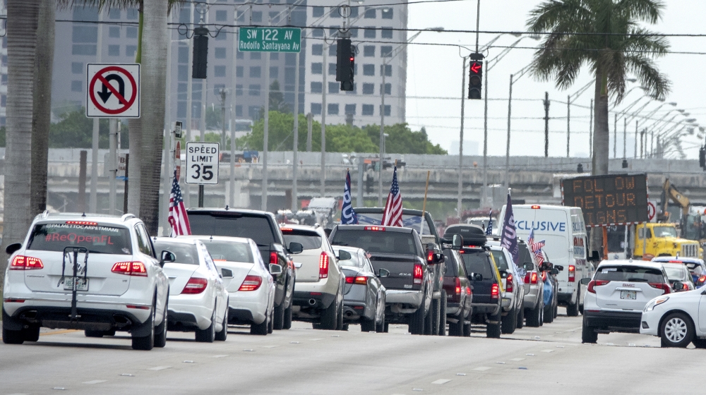 A group of protesters attend the 'Reopen Miami-Dade County' vehicle caravan, calling on state and local officials to reopen Florida's economy, in Miami, Florida, USA, 25 April 2020. The caravan was or