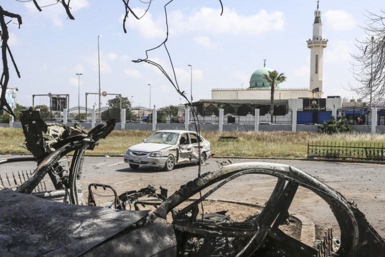 Warlord Khalifa Haftar’s forces target hospital for COVID-19 treatment- - TRIPOLI, LIBYA - APRIL 07: A vehicle is wrecked and another damaged after warlord Khalifa Haftar’s forces targeted Khadra hosp