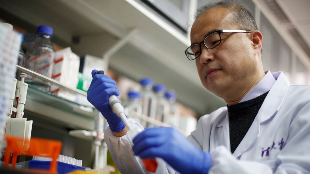 Scientist Linqi Zhang demonstrates work in his laboratory where he researches novel coronavirus disease (COVID-19) antibodies for possible use in a drug at Tsinghua University's Research Center 